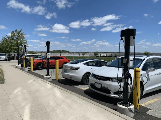 Image of electric vehicles standing at EV charging stations